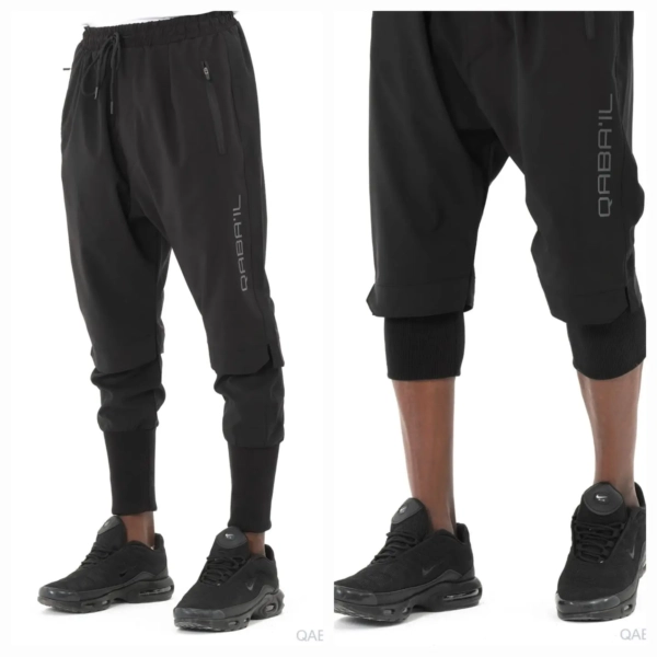 Sarouel Cross Over Noir Qaba'il --- Sarouel Cross Over – Le sarouel homme polyvalent, entre style, confort et performance Le Sarouel Cross Over est bien plus qu’un simple vêtement : c’est un indispensable pour tous les hommes actifs en quête de polyvalence, de confort et de liberté de mouvement. Pensé pour s’adapter à toutes les situations, ce sarouel s'impose comme un véritable tout-terrain, aussi bien en ville que dans des contextes plus extrêmes. Il est conçu pour répondre aux exigences du quotidien comme à celles d’une activité physique intense. Un design modulable : long ou court, à vous de choisir La particularité du Sarouel Cross Over, c’est sa modularité intelligente. Grâce à son large élastique au bas de chaque jambe, il se transforme en un clin d’œil : portez-le en version longue pour un style urbain, ou relevez-le au niveau du mollet pour une version courte, parfaite pour le sport ou les fortes chaleurs. Ce système simple et pratique vous permet d’ajuster votre tenue selon vos besoins, sans compromettre ni le style ni le confort. Un tissu léger et fluide pour un confort optimal Fabriqué à partir d’un tissu léger, fluide et respirant, ce sarouel vous accompagne toute la journée sans gêne ni surchauffe. Que vous soyez en mouvement ou au repos, vous profitez d’un vêtement agréable à porter, même par temps chaud. Ce tissu est également résistant, ce qui le rend parfaitement adapté à une utilisation régulière, voire intensive. Pour le sport, le travail et l’aventure Ce sarouel multifonction a été pensé pour les hommes qui bougent. Il convient à de nombreuses pratiques : Sport classique (course à pied, fitness, musculation, stretching) Sports extrêmes (parkour, escalade, randonnée intense) Travail actif (logistique, artisanat, métiers de terrain) Activités quotidiennes (marche, détente, sortie décontractée) Le Sarouel Cross Over est le couteau suisse de votre dressing. Il vous offre la liberté de mouvement indispensable aux sportifs, la solidité attendue par les travailleurs, et le confort recherché par tous. Ce mélange de technicité et de style en fait un vêtement aussi pratique qu’esthétique. Un style moderne et sobre Côté style, le Sarouel Cross Over adopte une coupe contemporaine avec une allure décontractée. Sa forme ample au niveau des jambes offre une touche streetwear tout en restant épurée. Il se porte facilement avec un t-shirt, un sweat ou même une veste légère. Que ce soit pour une tenue sportive ou urbaine, il s’intègre facilement dans votre quotidien. Disponible en trois coloris élégants : Noir : sobre et passe-partout Anthracite : discret et moderne Gris clair : lumineux et original Vous pouvez ainsi varier les styles tout en gardant la même performance. Boutique Sunnah : qualité, engagement et style Chez Boutique Sunnah, nous sélectionnons des vêtements pensés pour les hommes d’aujourd’hui : actifs, engagés et à la recherche d’un équilibre entre foi, confort et praticité. Le Sarouel Cross Over incarne pleinement ces valeurs. Il s’adresse à ceux qui veulent allier mode, pudeur et performance dans un vêtement unique. --- Pourquoi choisir le Sarouel Cross Over ? ✅ Adapté à toutes les saisons ✅ Polyvalent : sport, travail, loisirs ✅ Tissu léger, confortable et résistant ✅ Facile à enfiler et à ajuster ✅ Disponible en trois couleurs sur Boutique Sunnah --- Ajoutez dès maintenant le Sarouel Cross Over à votre garde-robe et découvrez un nouveau standard de confort et de praticité. Que vous soyez sportif, professionnel ou simplement en quête d’un vêtement fonctionnel au quotidien, ce sarouel est fait pour vous. --- Souhaitez-vous que je vous génère aussi la méta-description SEO (150–160 caractères) et des balises alt pour les images produit ?